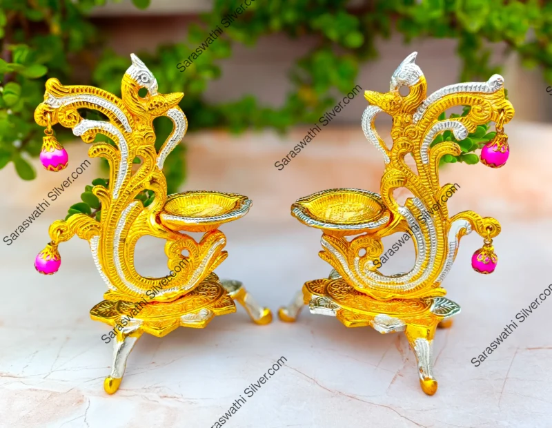 Gold plated peacock diya Decorative pooja deepam set Big size diya for home temple Traditional hanging diya with peacock Indian festival diya decor Brass look gold diya set Pooja room accessories online South Indian diya pair for gift Hanging diya for temple decoration