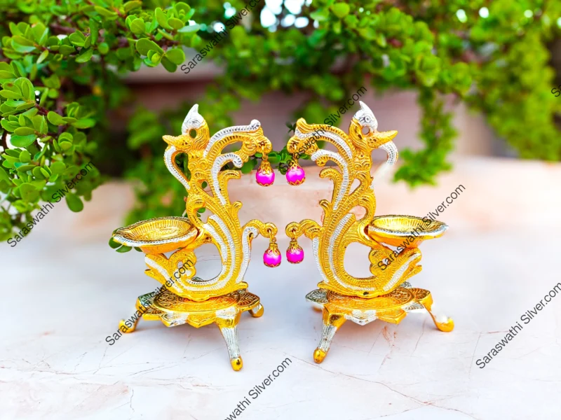 Gold plated peacock diya Decorative pooja deepam set Big size diya for home temple Traditional hanging diya with peacock Indian festival diya decor Brass look gold diya set Pooja room accessories online South Indian diya pair for gift Hanging diya for temple decoration